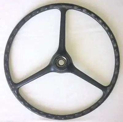 Black three-spoke steering wheel with center hub and textured rim