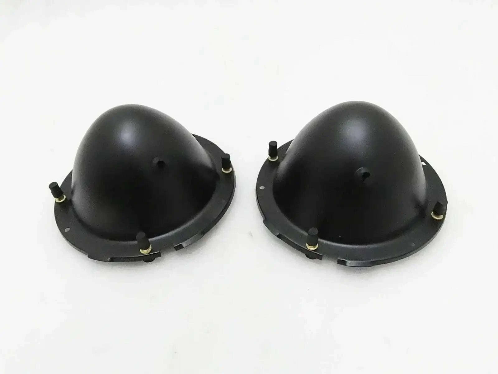 Pair of black headlight holding buckets with mounting tabs and screws