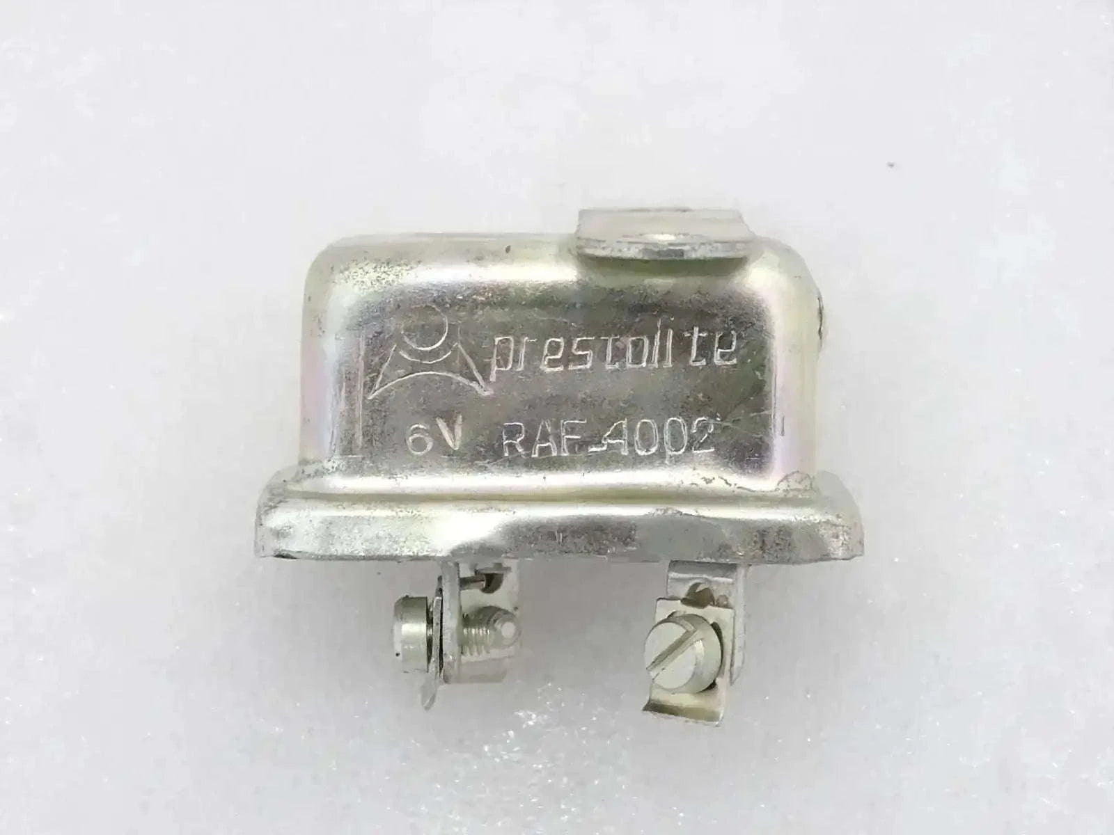 6-volt horn relay with metal housing and two electrical terminals