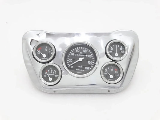 Chrome speedometer mounting plate with four gauges and illuminated dials