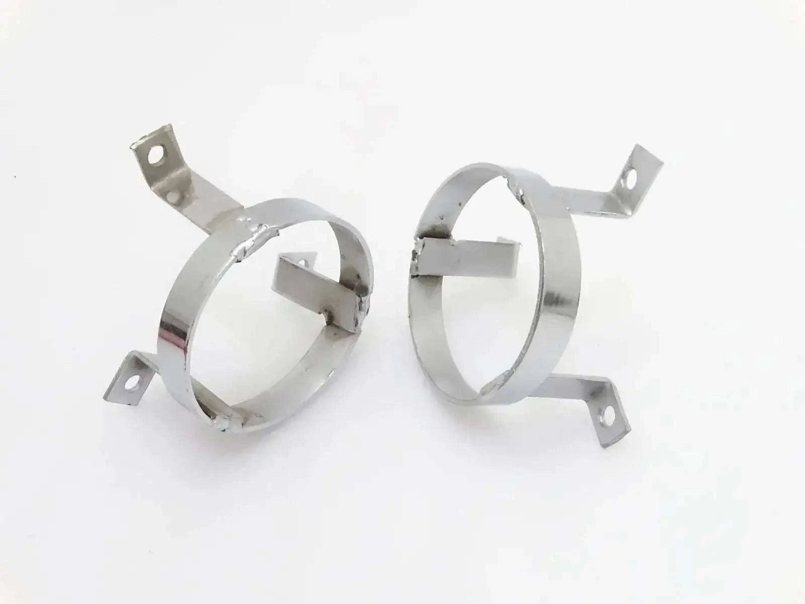 Pair of chrome parking light grill protectors with mounting brackets
