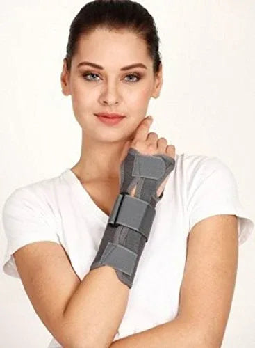 TYNOR wrist brace with dark gray support straps, worn on a wrist