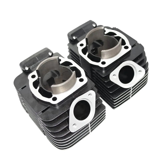 Yamaha RD350 cylinder piston kit featuring two black cylinder heads with precision engineering