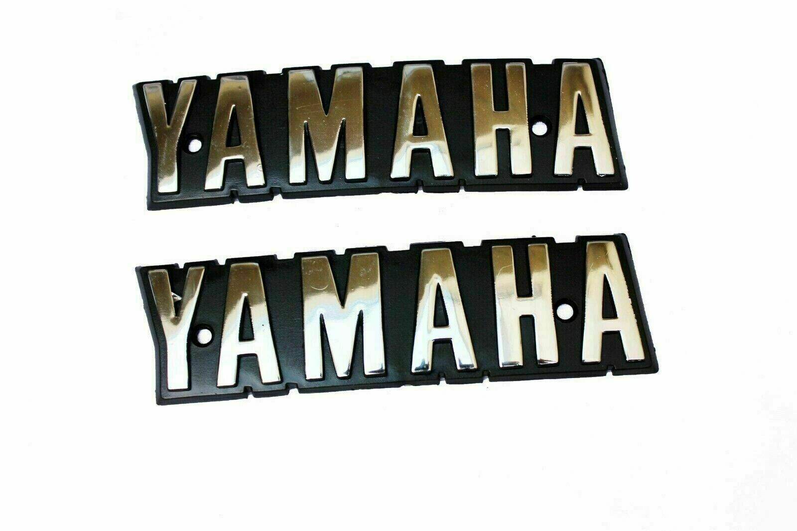 YAMAHA RX100 emblem decals set featuring chrome letters on a black background for motorcycle enthusiasts
