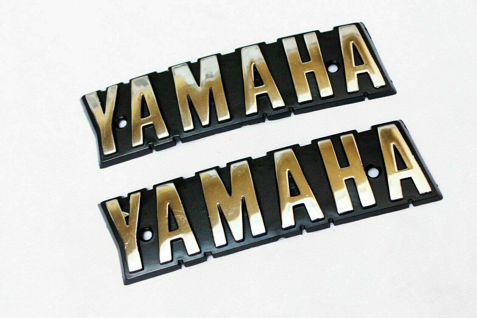 YAMAHA RX100 emblem decals in gold and black, perfect for motorcycle restoration