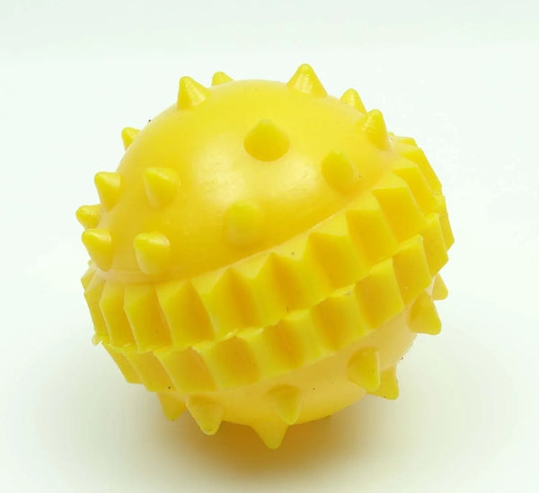 Yellow plastic spiked ball designed to improve digestive system as a probiotic for digestive health