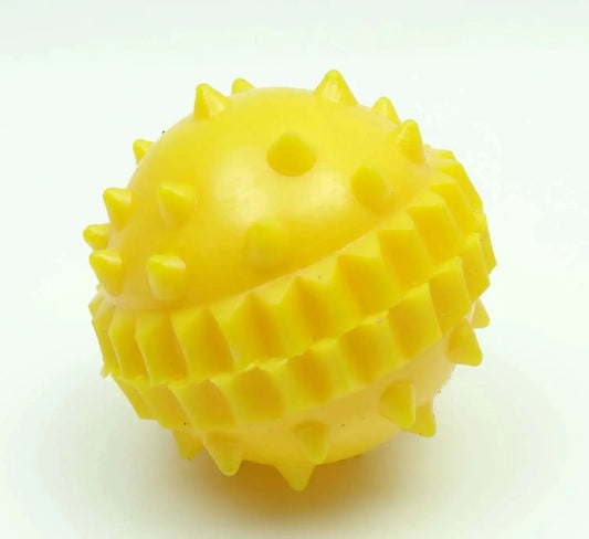 Yellow spiky plastic ball with small holes