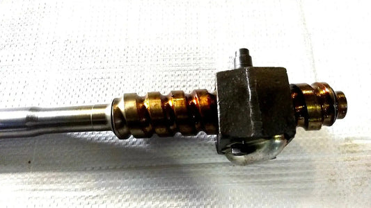 Tractor steering shaft with threaded ends and black mounting block
